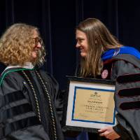 Provost Drake giving Karyn Rabourn her award